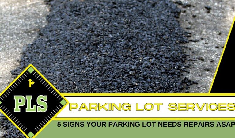 Sealcoating being applied to asphalt parking lot surface